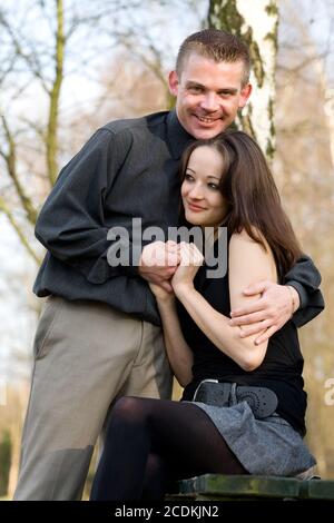 Young man protecting his girlfriend Stock Photo