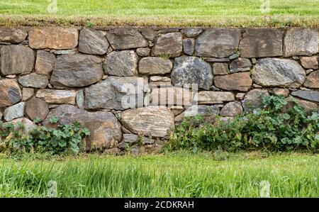 Tightly Constructed Beautiful Old Stone Wall in a Field at Stroud Preserve, Chester County, Pennsylvania, USA Stock Photo