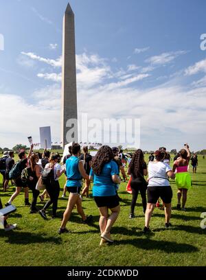 Washington, DC, USA, 28 August, 2020.  Pictured: Anti-racism protesters walk by the Washington Monument and across the National Mall to attend the  March on Washington on a sweltering August day.  Credit: Allison C Bailey/Alamy Credit: Allison Bailey/Alamy Live News Stock Photo