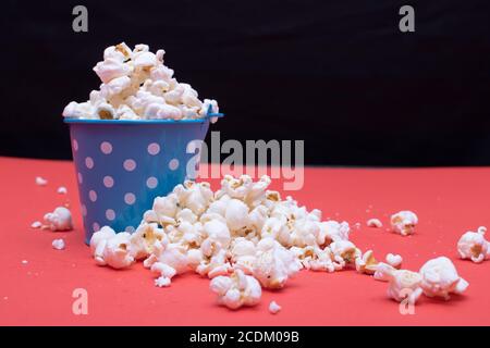 Popcorn on a red background Stock Photo