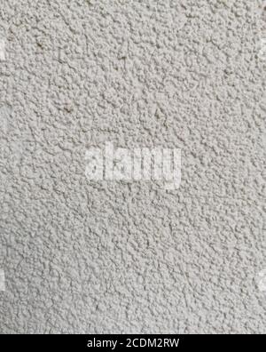 Detail of the facade of the house, wall plastered and painted in gray Stock Photo