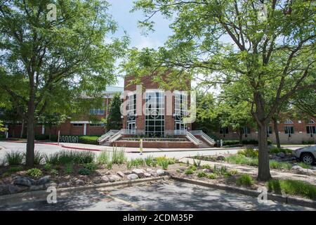 Aurora, Illinois, United States-April 19,2014: Eola Community Center brick building with springtime flora under a blue sky in Aurora, Illinois Stock Photo