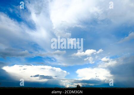 Amazing dramatic sky. Cloudy weather turning rainy. Cumulonimbus in atmosphere. Stock Photo