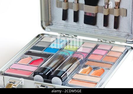 Multicolored eye shadows with cosmetics brush. Eyeshadow makeup palette. Colorful eye shadow make up. Stock Photo