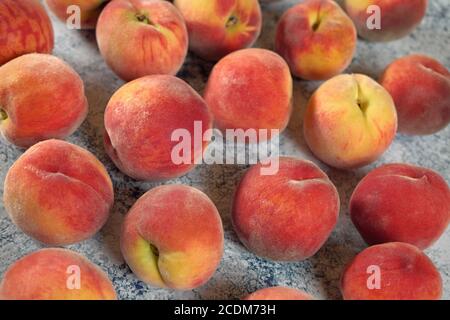 Group of apricots on blue marble like board, closeup photo Stock Photo