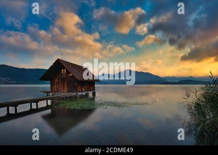 Boathouse on Lake Zug at sunset, behind it mountain Rigi, Canton Zug, Switzerland Stock Photo