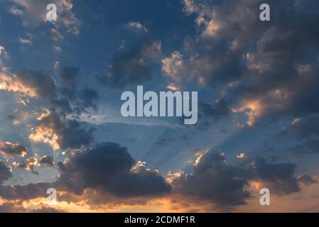 Sun behind the clouds in the evening sky, Bavaria, Germany Stock Photo