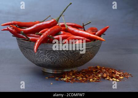 Chilli peppers in shell and chilli flakes, Germany Stock Photo