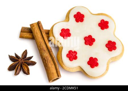 Gingerbread cookies with royal icing in the shape of a flower with star anise and cinnamon Stock Photo