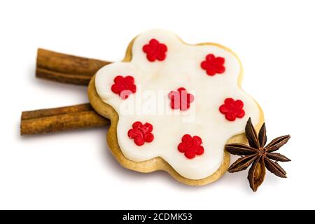 Gingerbread cookies with royal icing in the shape of a flower with star anise and cinnamon Stock Photo