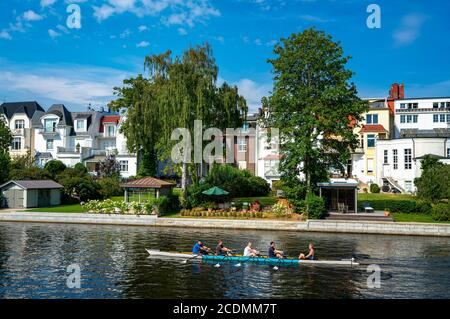 Rowing boat with recreational athletes on the Alster in Hamburg Winterhude, Hamburg, Germany Stock Photo