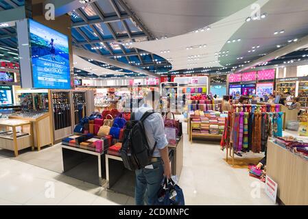 people shop at duty free haberdashery boutiques, Bangkok airport Stock Photo