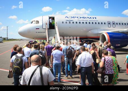 Volgograd, Russian Federation, August 07,2015:  People boarding in the airplaine. Stock Photo