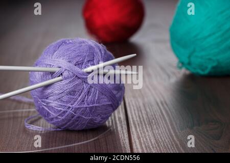 knitting needles and balls of threads Stock Photo