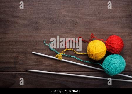 knitting needles and ball of threads Stock Photo