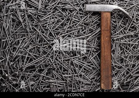 old hammer and nails on table Stock Photo