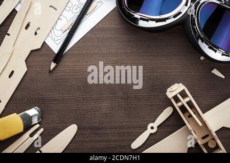 handmade airplane on brown wooden table Stock Photo