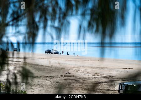 4WDs parked on beach with people fishing and relaxing, Burrum National park Queensland, Australia Stock Photo