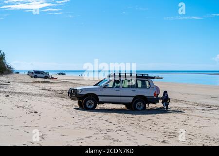 4WDs parked on beach with people fishing and relaxing, Burrum National park Queensland, Australia Stock Photo