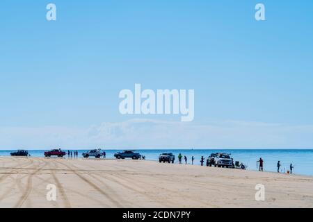 4WDs parked on beach with people fishing and relaxing, Burrum National park Queensland, Australia Stock Photo