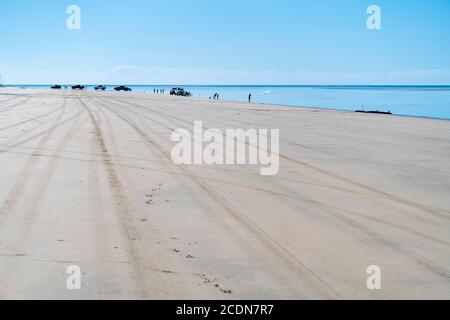 4WDs parked on beach with people fishing and relaxing, Burrum National park Queensland, Australia Stock Photo