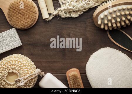some bath accessories on brown wooden background Stock Photo