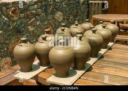 Many pots kept for drying in the sun Stock Photo