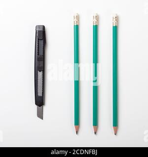 Three pencils with a cutter, isolated on white background Stock Photo