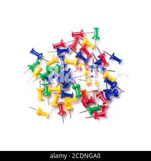 colorful push pins on white background. Stock Photo