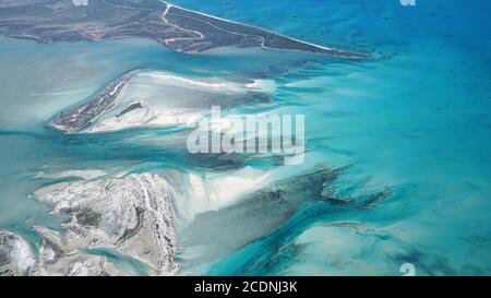 View from above of the water of the Bahamas, shining in different shades of blue Stock Photo