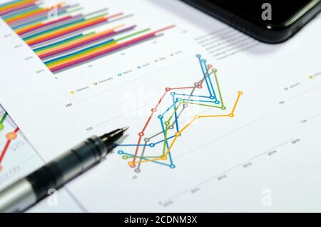 Graphs and pen Stock Photo