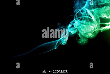 Green and blue smoke on dark Stock Photo