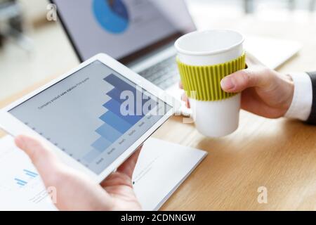 businessman checking financial reports on table Stock Photo