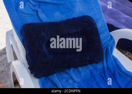 sun lounger towel pillow on beach Stock Photo