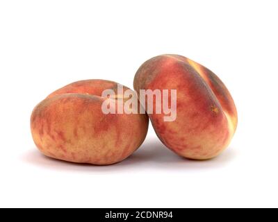 Flat peaches isolated against a white background Stock Photo