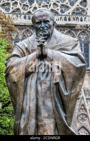 Pope John Paul II statue next to Notre Dame Cathedral in Paris, France. Stock Photo