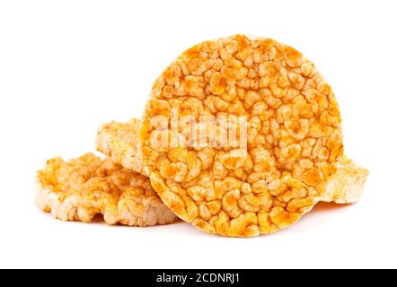 Caramelized rice-corn crispbread, isolated on white background. Sweet puffed whole grain crispbread. Stock Photo