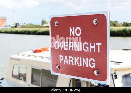 No overnight parking sign board in Reedham, Norfolk, England Stock Photo