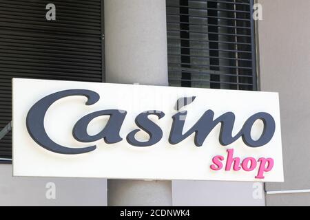 Lyon, France - May 21, 2020: Casino shop logo on a wall. Casino shop is a French convenience store belonging to the Casino Group Stock Photo