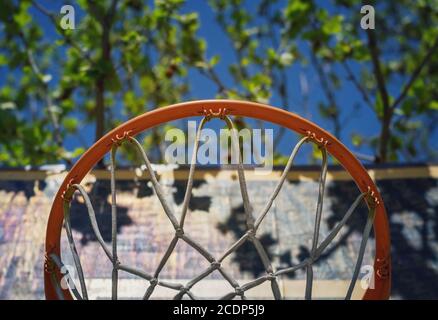 Detail of a basketball hoop on the playground viewed from below Stock Photo