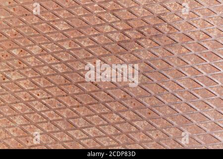 An old steel sheet with a pattern of rhombuses, founded in abandoned house Stock Photo
