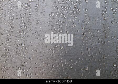 Raindrops on steel wall detail Stock Photo