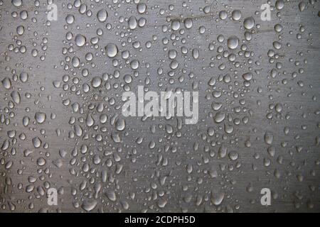 Raindrops on steel wall detail Stock Photo