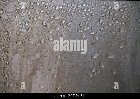 Raindrops on steel wall detail Stock Photo