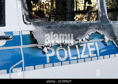 Burnt-out cars after an arson attack on police cars in the center of Magdeburg Stock Photo