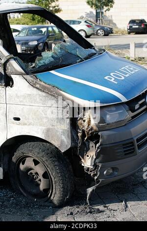 Burnt-out cars after an arson attack on police cars in the center of Magdeburg Stock Photo