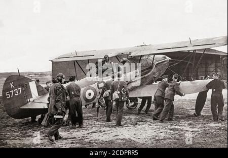 A Hawker Audax photographed in 1940. The biplane, a variant of the Hawker Hart, designed for army cooperation saw service in the British Empire. With its maiden flight in late 1931, the Audax was similar to the Hart, though had some modifications, including a hook to pick up messages. Powered by a Kestrel engine, it had a maximum speed of 170 mph (274 km/h and was armed with a single .303 in (7.7 mm) Lewis light machine gun and a .303 in (7.7 mm) Vickers machine gun. Stock Photo