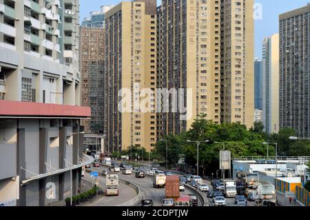 Lung Cheung Road, a highway in Kowloon, Hong Kong, with Lower Wong Tai Sin Estate in the background. Stock Photo