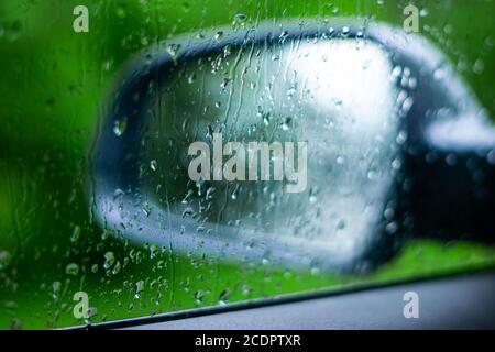 wet car wing mirror Stock Photo