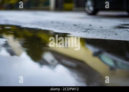 rain puddle on the street Stock Photo